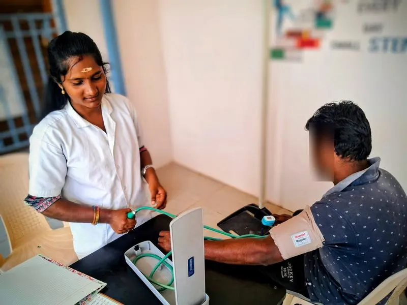 nurse examining patient